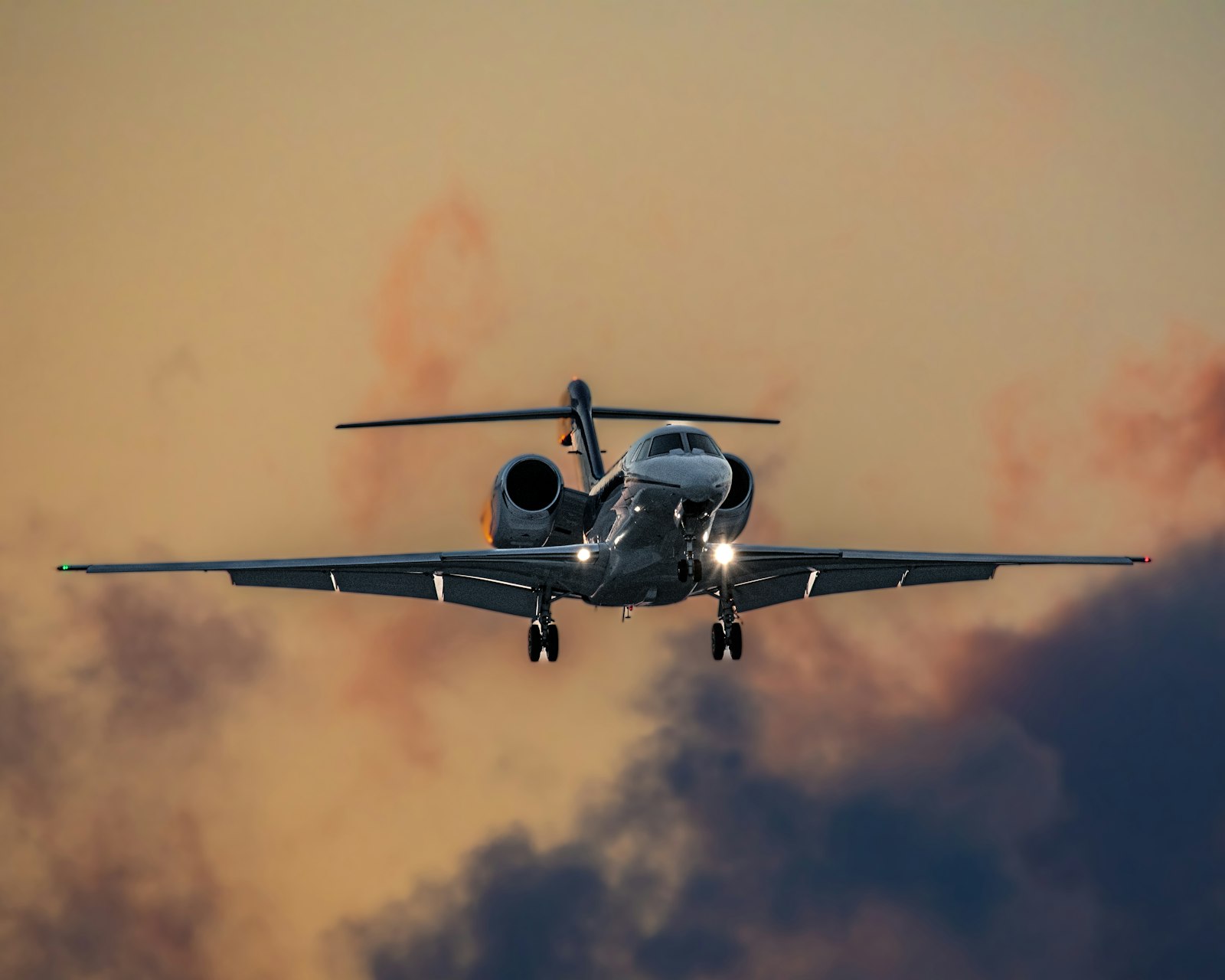 Heavy business jet in flight above the clouds